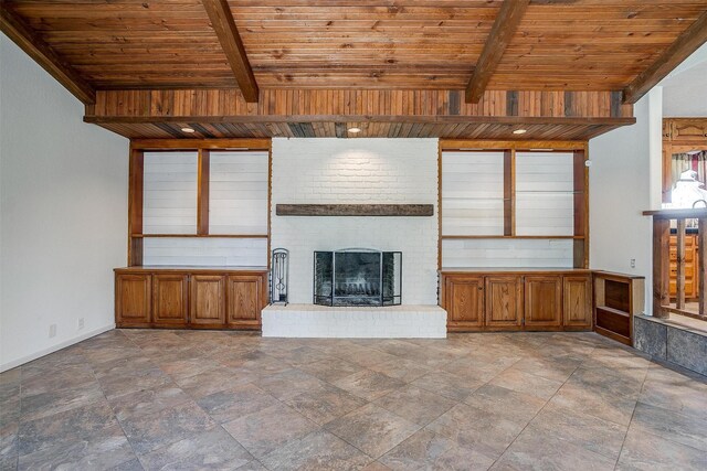 unfurnished living room with ceiling fan, vaulted ceiling with beams, and wooden ceiling