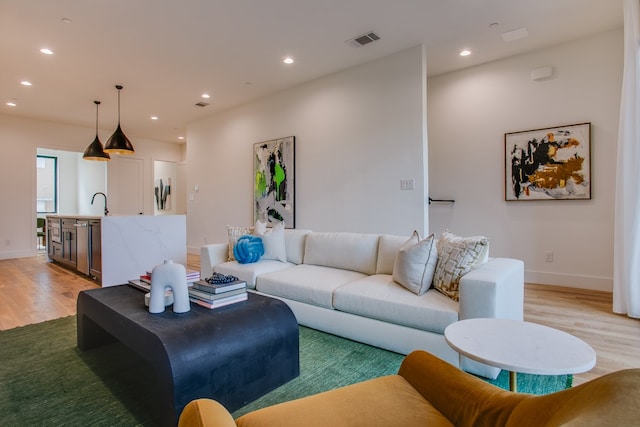 living room with light hardwood / wood-style floors