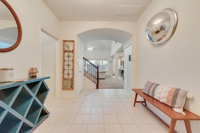 interior space with ceiling fan