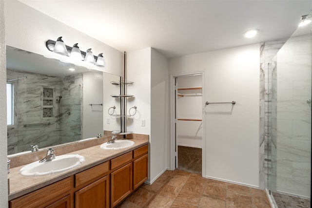 bathroom with vanity and a shower with door