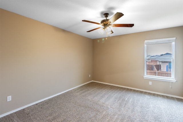 empty room with carpet flooring and ceiling fan