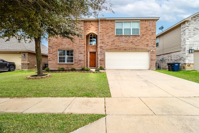 view of front of property with a garage and a front lawn