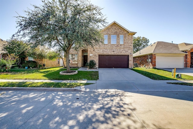 front of property featuring a garage and a front lawn