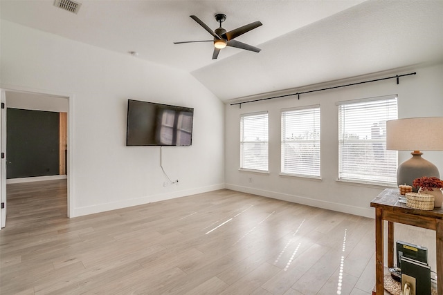 unfurnished living room featuring ceiling fan, light hardwood / wood-style floors, and lofted ceiling