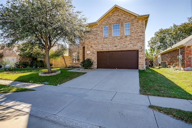 view of property with central AC, a garage, and a front lawn