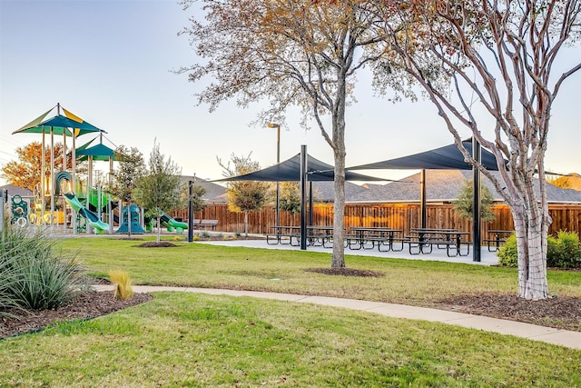 view of community featuring a playground and a yard