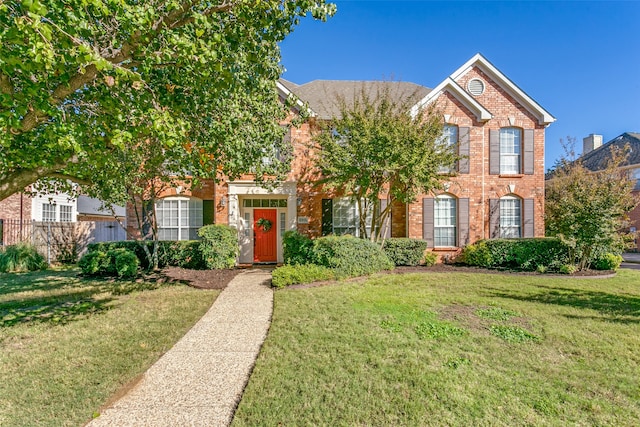 view of front of house with a front lawn