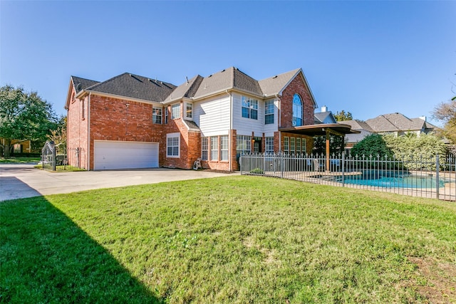 exterior space with a garage, a fenced in pool, and a front yard