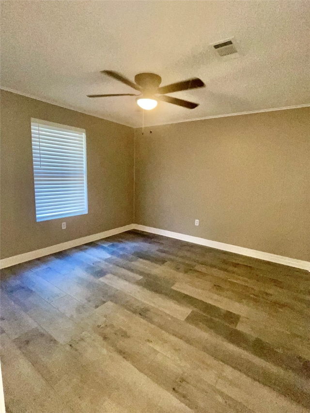 unfurnished room featuring hardwood / wood-style flooring, ceiling fan, and a textured ceiling