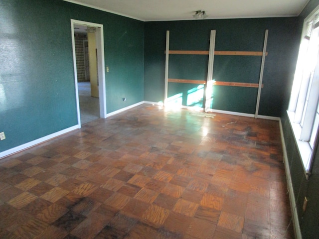 spare room with dark parquet flooring