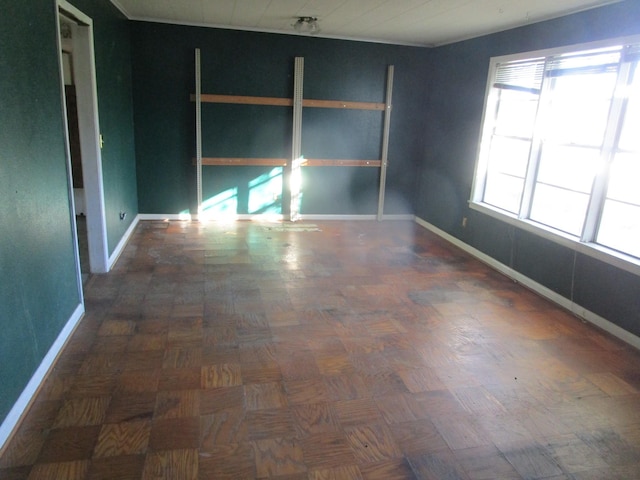 empty room with dark parquet flooring