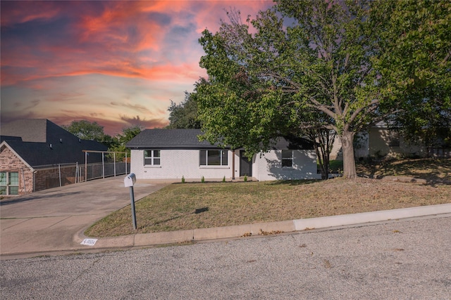 view of front of house with a yard