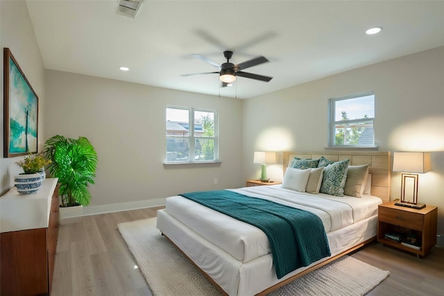 bedroom featuring light wood-type flooring and ceiling fan