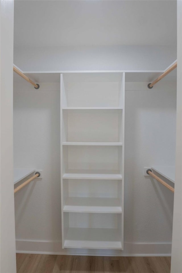 walk in closet featuring hardwood / wood-style flooring