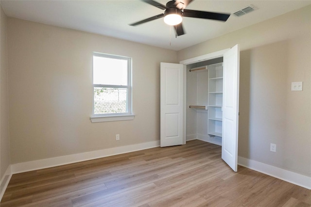 unfurnished bedroom with a closet, ceiling fan, and light hardwood / wood-style flooring