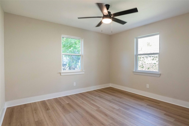 unfurnished room with ceiling fan and light hardwood / wood-style flooring