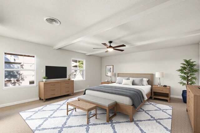 kitchen with white cabinets, appliances with stainless steel finishes, a barn door, and hardwood / wood-style floors