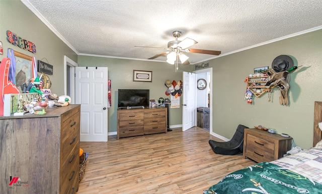 3756 Greenway Pl, Shreveport, LA 71105 - bedroom with light wood-type flooring, crown molding, a textured ceiling, ceiling fan, and baseboards