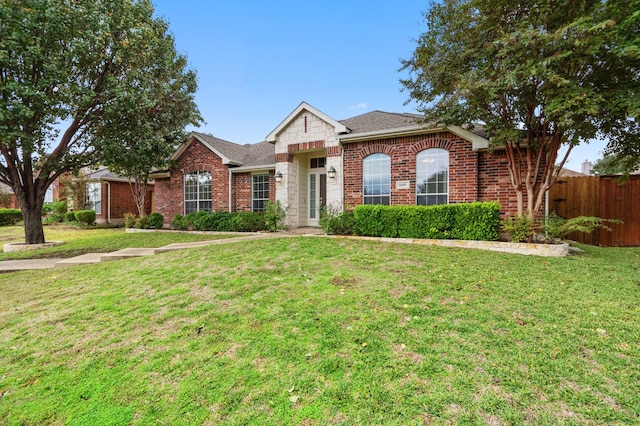 ranch-style house featuring a front lawn