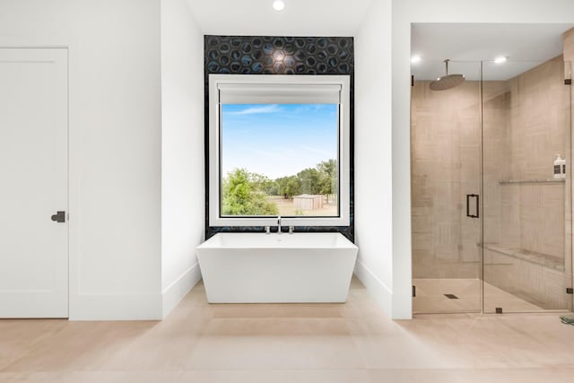 7517 Sunnyview Ln, Flower Mound, TX 75022 - bathroom with a shower stall, recessed lighting, baseboards, and a freestanding bath