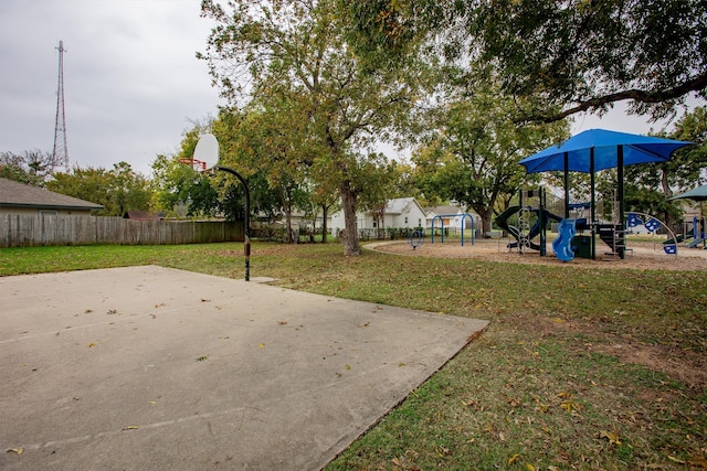 view of patio featuring a playground and basketball court