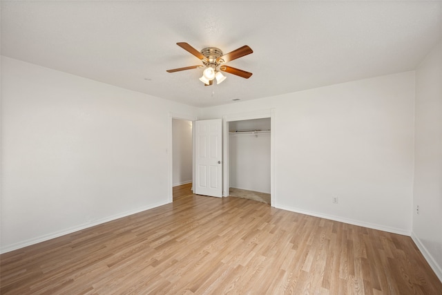 unfurnished bedroom featuring a closet, ceiling fan, and light hardwood / wood-style flooring