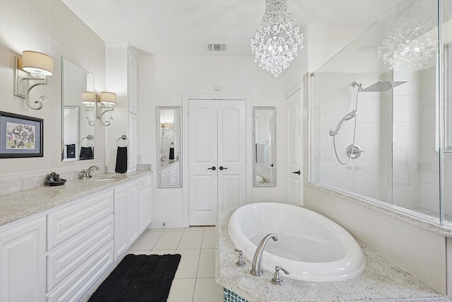 bathroom featuring vanity, separate shower and tub, and tile patterned flooring