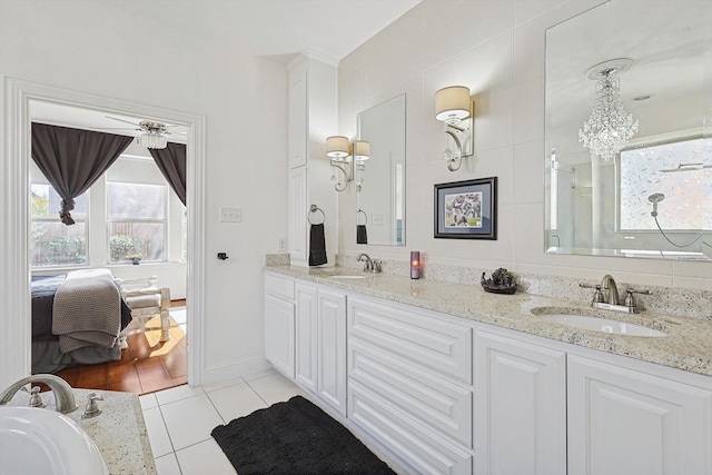 bathroom with vanity, tile patterned floors, and ceiling fan