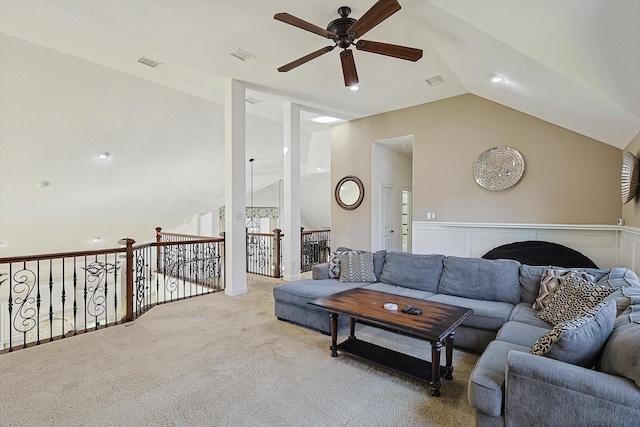 carpeted living room featuring vaulted ceiling and ceiling fan