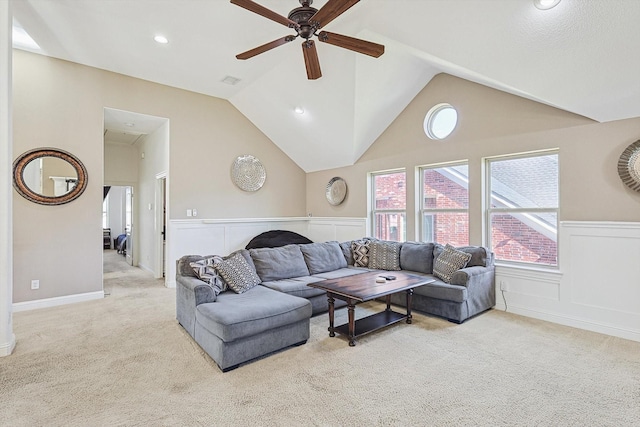 carpeted living room featuring plenty of natural light, lofted ceiling, and ceiling fan