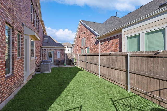 view of yard featuring central AC unit