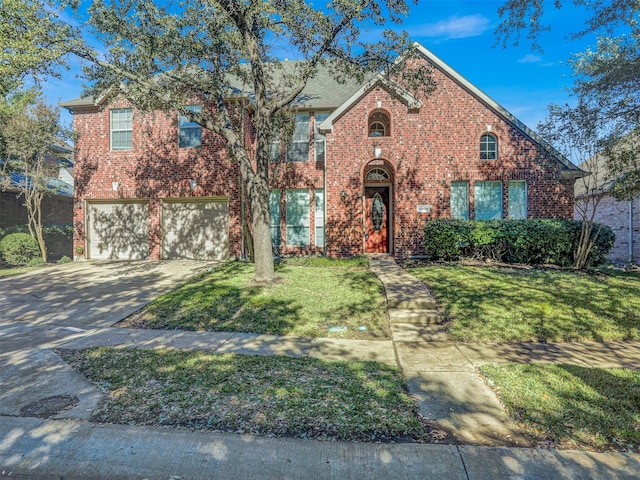 front facade featuring a garage and a front yard