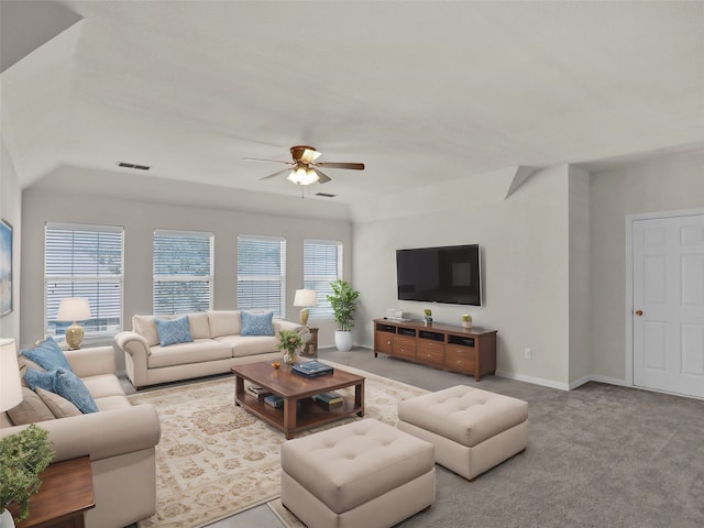 carpeted living room with ceiling fan and a wealth of natural light