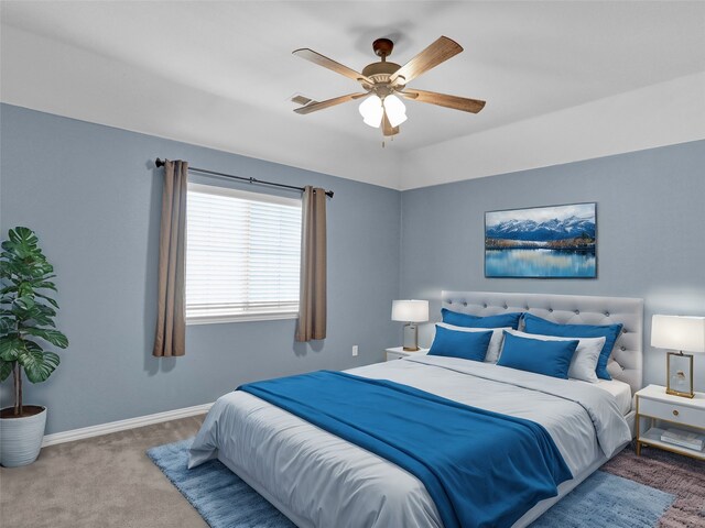 carpeted office with vaulted ceiling and ceiling fan