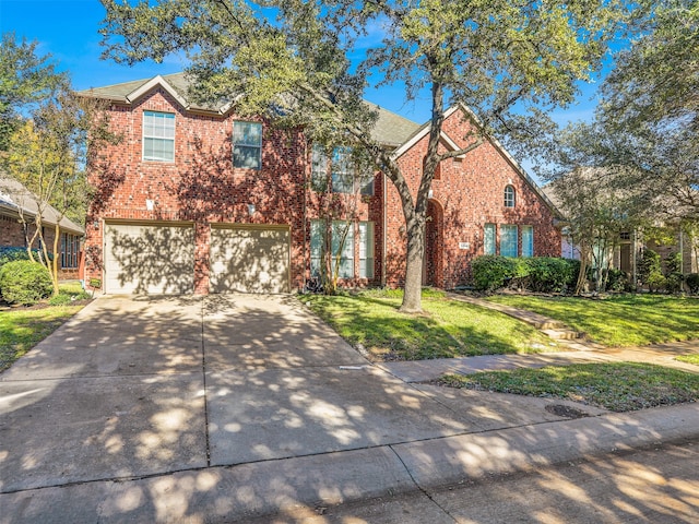 view of front of house featuring a garage and a front lawn