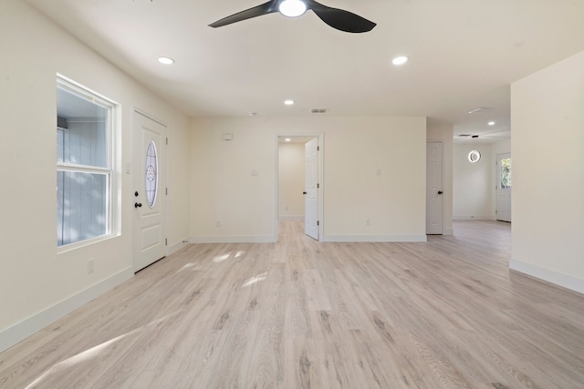 interior space featuring ceiling fan and light hardwood / wood-style flooring