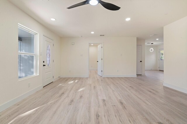 interior space with ceiling fan and light hardwood / wood-style flooring