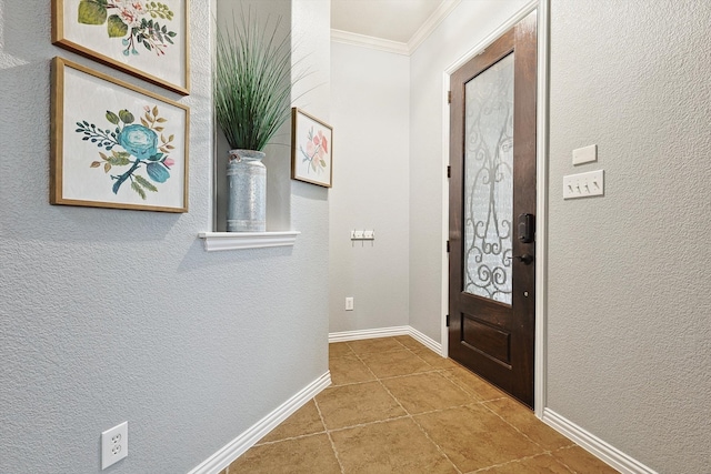 tiled entrance foyer featuring ornamental molding