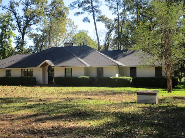 single story home with a front yard