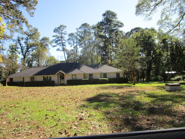 ranch-style house with a front yard