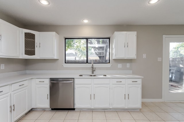 kitchen with dishwasher, white cabinetry, a healthy amount of sunlight, and sink