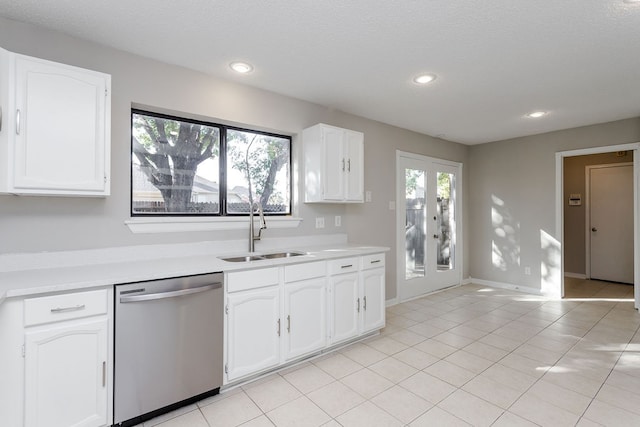 kitchen with french doors, stainless steel dishwasher, a wealth of natural light, and sink