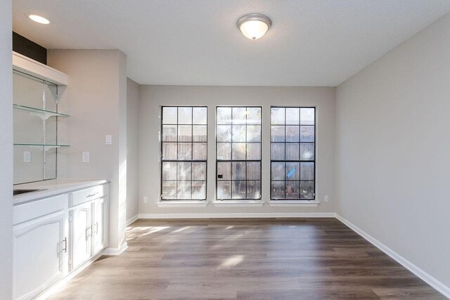 unfurnished dining area with light hardwood / wood-style flooring