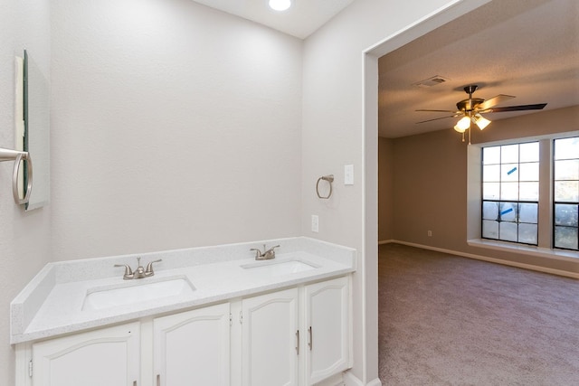 bathroom featuring ceiling fan and vanity