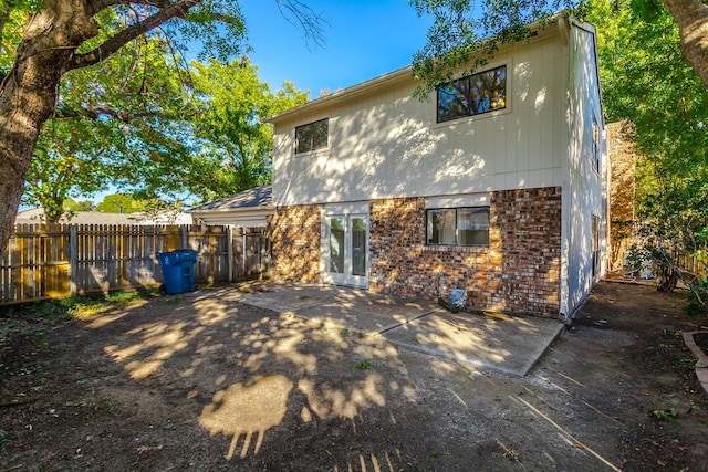 back of property featuring a patio area