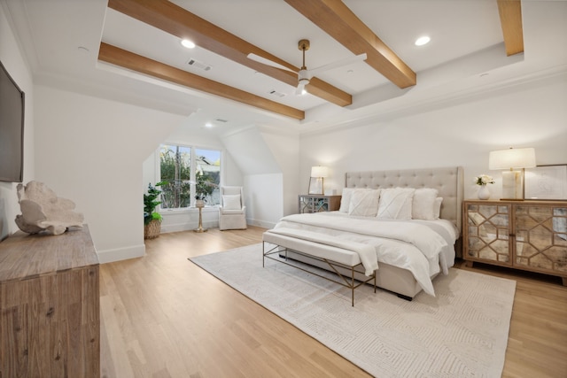 bedroom with beamed ceiling, light wood-type flooring, and ceiling fan