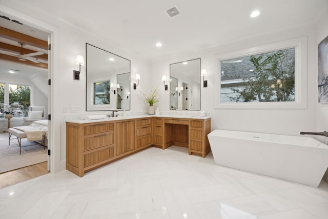 bathroom featuring beamed ceiling, vanity, a bath, and crown molding