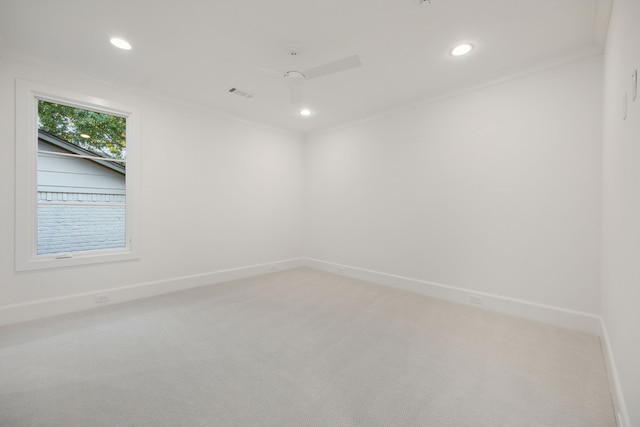 empty room with carpet, ceiling fan, and ornamental molding