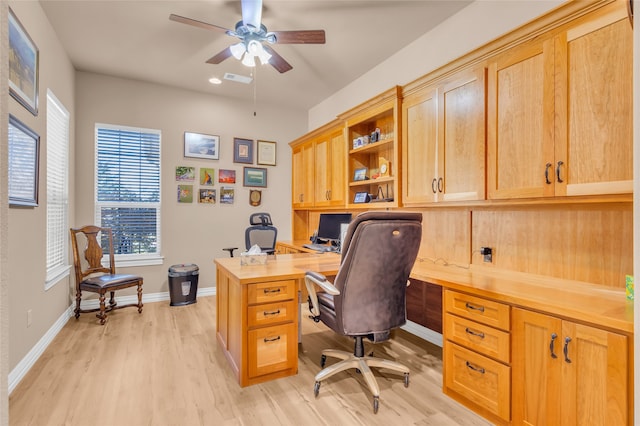 office area with light wood-type flooring and ceiling fan