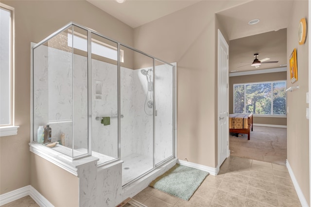 bathroom featuring tile patterned floors, ceiling fan, vanity, and walk in shower